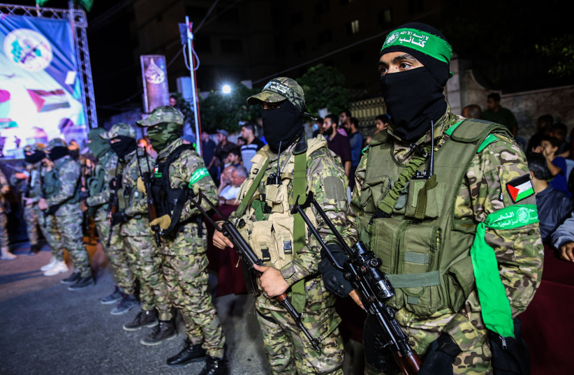  Members of the Al-Qassam Brigades take part in a military festival organized by Hamas to honor the dead Palestinians who were killed by the Israeli army in the West Bank, Jerusalem and the Gaza Strip, in Gaza City, on October 4, 2021 (credit: ATIA MOHAMMED/FLASH90)