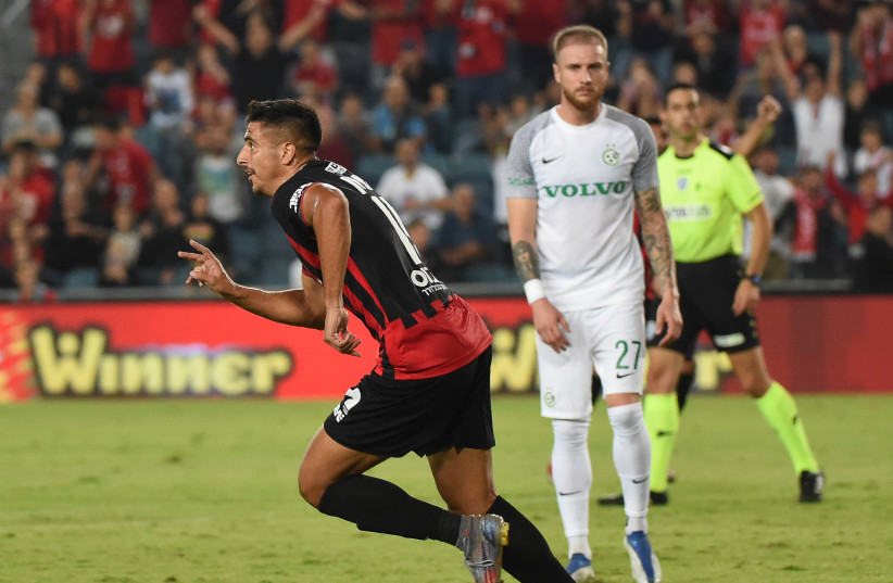  HAPOEL JERUSALEM (in red) earned perhaps its biggest victory since being promoted last year, beating reigning Israeli champion Maccabi Haifa 3-0 at Teddy Stadium (credit: BERNEY ARDOV)