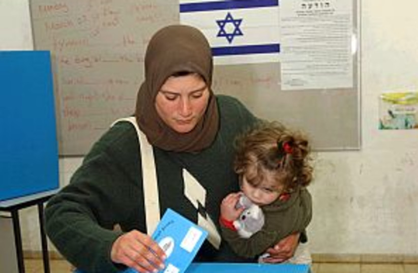 arab woman, child vote (photo credit: Ariel Jerozolimski )