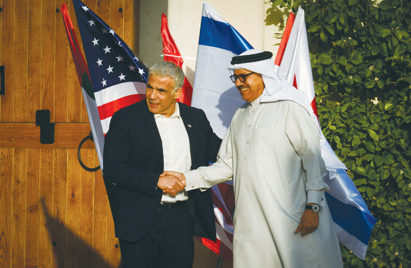  PRIME MINISTER Yair Lapid, as foreign minister, greets Bahrain’s Foreign Minister Abdullatif bin Rashid al-Zayani, at the Negev Summit in Sde Boker, in March. What is certain is that both the Gulf Cooperation Council and Israel share a common view of the Iranian nuclear threat, says the writer. (photo credit: FLASH90)