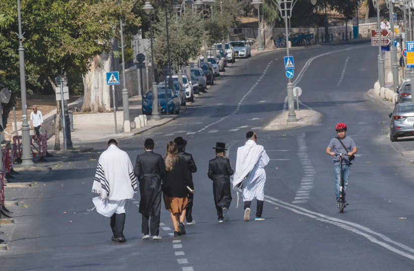  PEOPLE ON THE empty Jerusalem roads, on Yom Kippur. (credit: FLASH90)