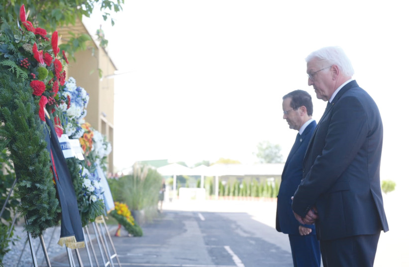 President Isaac Herzog and German President Frank-Walter Steinmeier lay wreaths in memory of the victims of the massacre at the 1972 Munich Olympics, on the anniversary last month. (credit: AMOS BEN-GERSHOM/GPO)