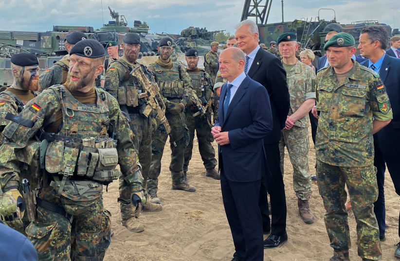  PREVIEW German Chancellor Olaf Scholz and Lithuanian President Gitanas Nauseda visit German troops of the NATO enhanced Forward Presence Battlegroup in Pabrade, Lithuania June 7, 2022. Picture taken June 7, 2022. (photo credit: REUTERS/Andreas Rinke)
