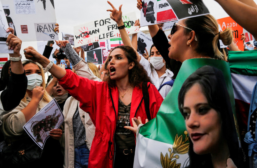  FILE PHOTO: Protesters shout slogans during a demonstration following the death of Mahsa Amini in Iran, in Istanbul, Turkey, October 2, 2022.  (credit: REUTERS/Dilara Senkaya/File Photo)
