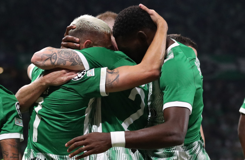  MACCABI HAIFA teammates celebrate after Omer Atzili's first goal in the seventh minute sent the Greens on their way to a shocking 2-0 victory over Juventus on Tuesday night in their Champions League Group H clash at Sammy Ofer Stadium (credit: RONEN ZVULUN)