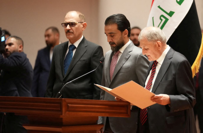 Abdul Latif Rashid takes his oath of office in front of Iraqi lawmakers in Baghdad, Iraq, October 13, 2022. (photo credit: IRAQI PARLIAMENT MEDIA OFFICE/HANDOUT VIA REUTERS)