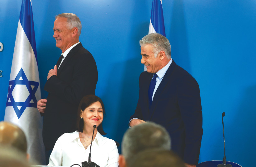  PRIME MINISTER Yair Lapid, Defense Minister Benny Gantz and Energy Minister Karin Elharrar attend a news conference on the maritime agreement with Lebanon, at the Prime Minister’s Office, last week.  (credit: OLIVIER FITOUSSI/FLASH90)