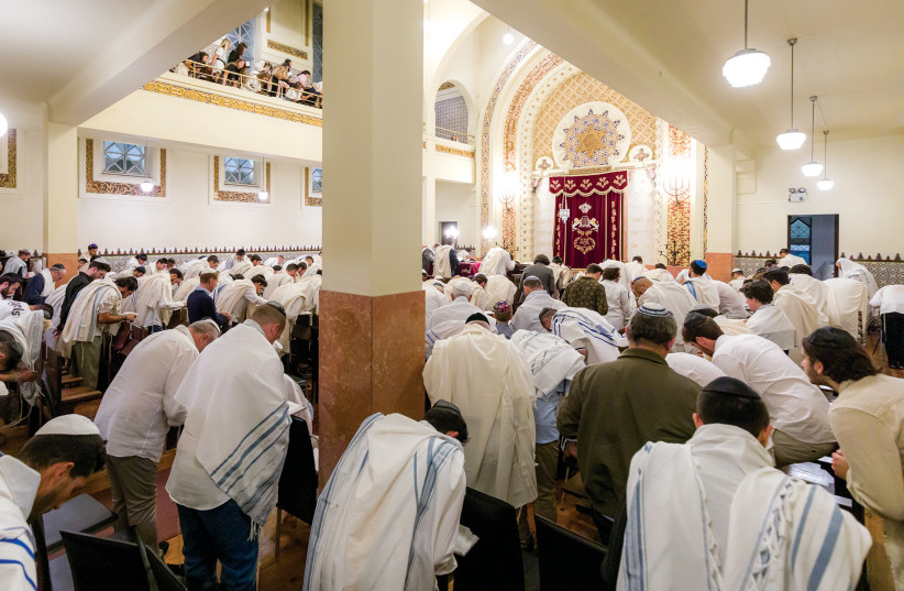  Hundreds of people pray at the Kadoorie Mekor Haim Synagogue in Porto on Yom Kippur (The photograph was taken from a surveillance camera). (credit: CIP/CJP)