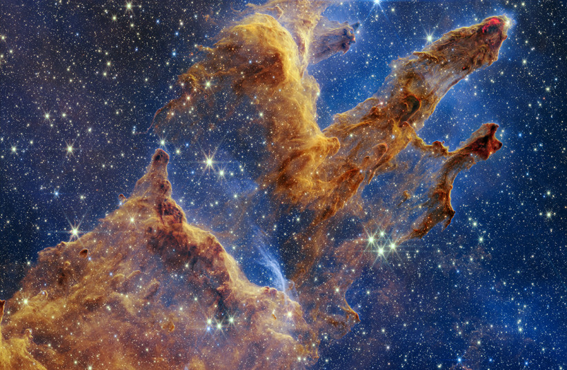  The Pillars of Creation are set off in a kaleidoscope of color in NASA’s James Webb Space Telescope’s near-infrared-light view. The pillars look like arches and spires rising out of a desert landscape, but are filled with semi-transparent gas and dust, and ever changing.  (credit: NASA)