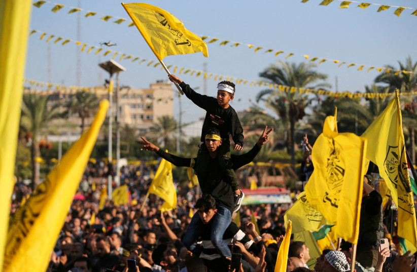 Palestinians take part in a Fatah rally marking the 18th anniversary of the death of late Palestinian leader Yasser Arafat, in Gaza City November 10, 2022.