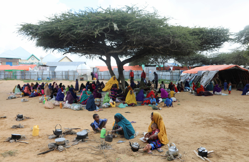  People affected by the worsening drought due to failed rain seasons, gather at the Alla Futo camp for internally displaced people, in the outskirts of Mogadishu (photo credit: REUTERS)