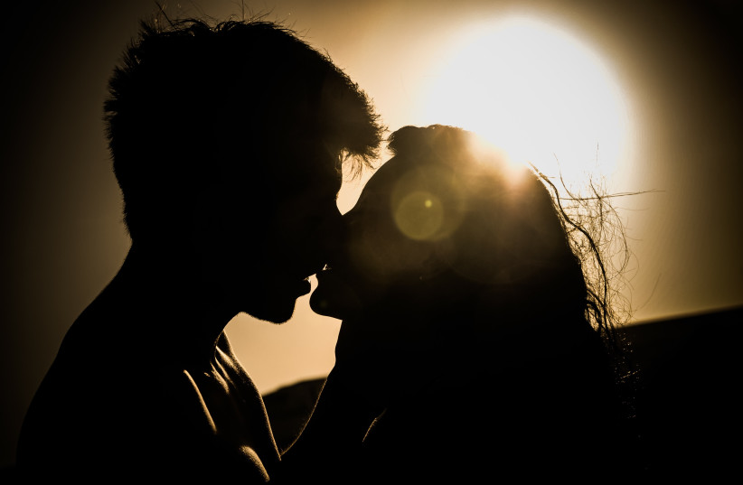  Silhouette of a couple kissing (illustrative) (photo credit: PEXELS)