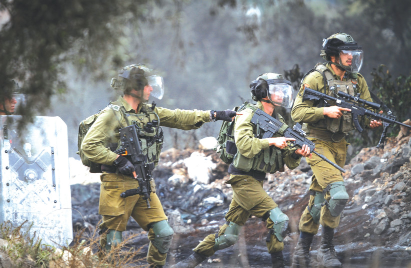  IDF FORCES in action at a village near Nablus last month.  (credit: NASSER ISHTAYEH/FLASH90)