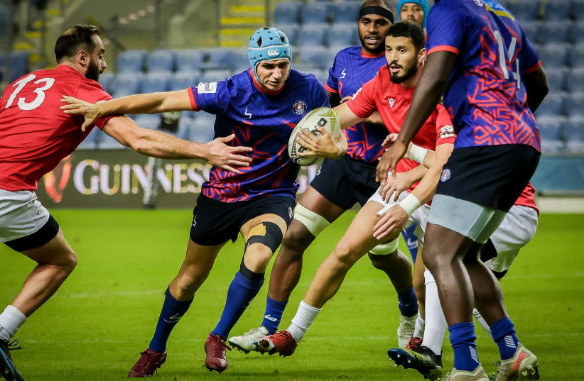 The Tel Aviv Heat (in blue) has been a success, both on and off the pitch, as it helps reignite the spirit of rugby throughout Israel. (photo credit: TSAHI REIZEL/COURTESY)