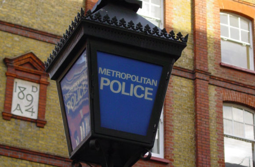 A photo of a traditional ''blue lamp'' as located outside most English police stations. This one is outside the Charing Cross Police Station of the Metropolitan Police in London. (credit: CANLEY/PUBLIC DOMAIN/VIA WIKIMEDIA COMMONS)