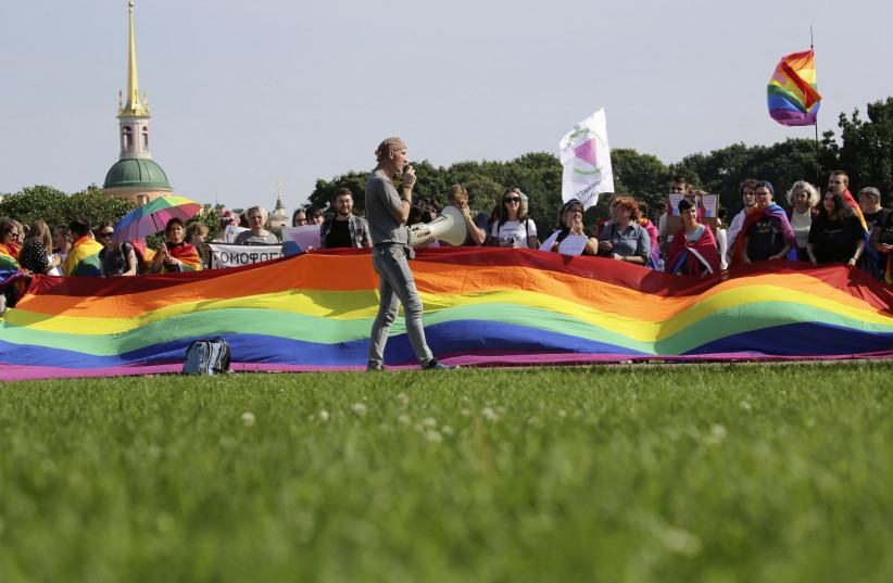 People take part in the LGBT (lesbian, gay, bisexual, and transgender) community rally ''VIII St.Petersburg Pride'' in St. Petersburg, Russia August 12, 2017. (credit: REUTERS/ANTON VAGANOV)