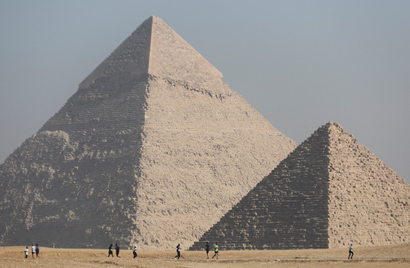  View of the Great Pyramids of Giza during  the fourth annual Pyramids Half Marathon named "Race Through History" in 2022, in Giza, Egypt December 10, 2022.  (photo credit: REUTERS/AMR ABDALLAH DALSH)