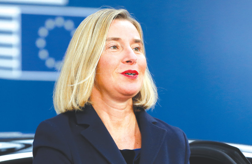 THEN-EUROPEAN Union foreign policy chief Federica Mogherini arrives at an EU summit, in Brussels, in 2019. She was an honorary board member pictured on the Fight Impunity website before resigning and distancing herself, says the writer. (credit: Julien Warnand/Reuters)
