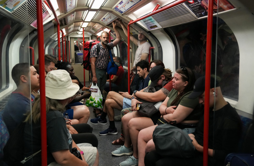  Commuters travel on the London Underground during a heatwave in London, Britain, July 18, 2022. (credit: REUTERS/Maja Smiejkowska)