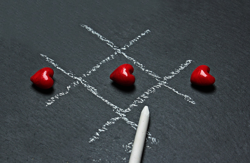  Illustration of tic-tac-toe board with love hearts. (credit: PEXELS)