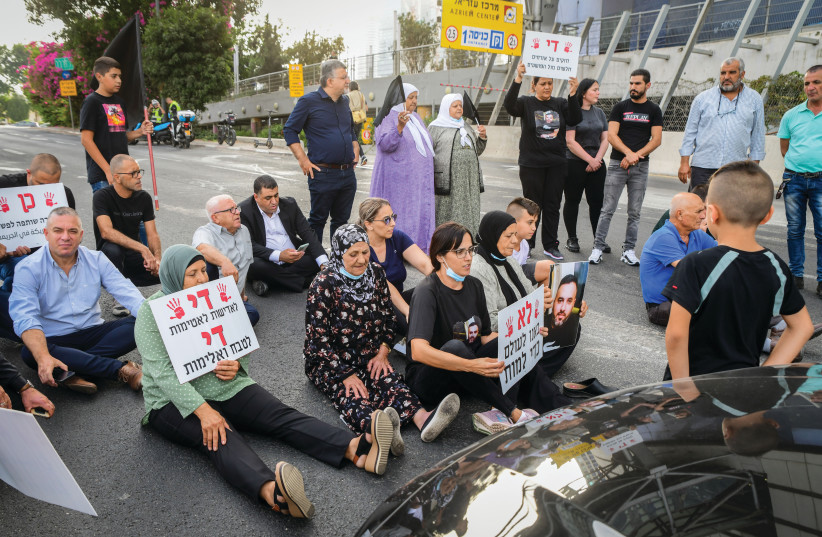  DEMONSTRATORS BLOCK a road in Tel Aviv to protest the indifference of authorities toward organized crime, violence and murder in the Arab sector.  (credit: AVSHALOM SASSONI/FLASH90)
