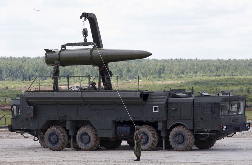Russian servicemen equip an Iskander tactical missile system at the Army-2015 international military-technical forum in Kubinka, outside Moscow, Russia, June 17, 2015. (photo credit: REUTERS/SERGEI KARPUKHIN)