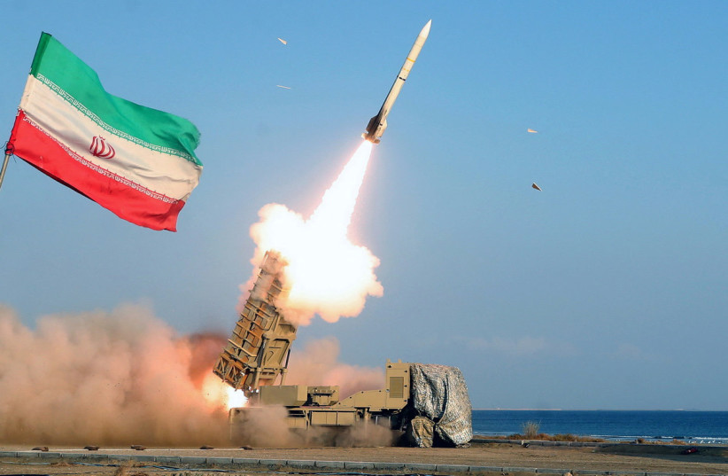  A missile is launched during an annual drill in the coastal area of the Gulf of Oman and near the Strait of Hormuz, Iran (photo credit: REUTERS)