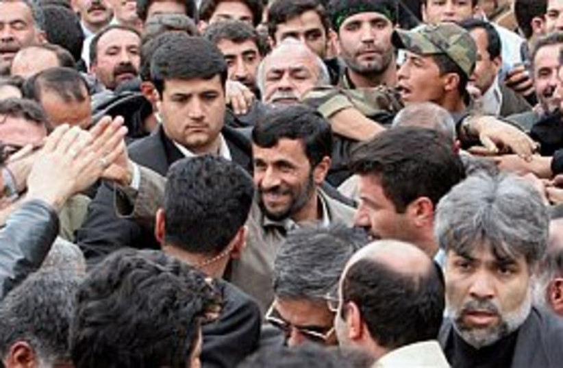 ahmadinejad surrounded b (photo credit: AP)