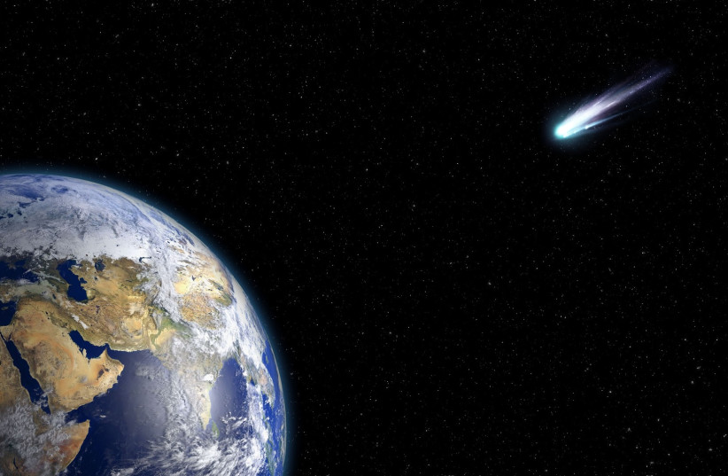  A comet is seen flying by the Earth (Illustrative). (photo credit: PIXABAY)