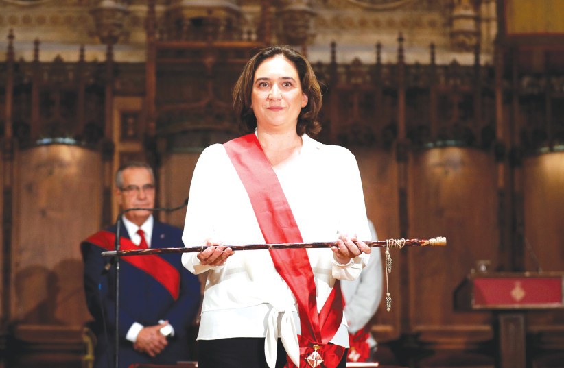  ADA COLAU poses during her swearing-in ceremony as the new mayor of Barcelona, in 2019. (credit: ALBERT GEA/ REUTERS)