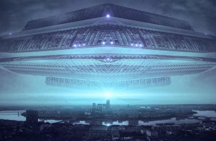  An alien UFO is seen above a city in this illustrative image. (photo credit: PIXABAY)