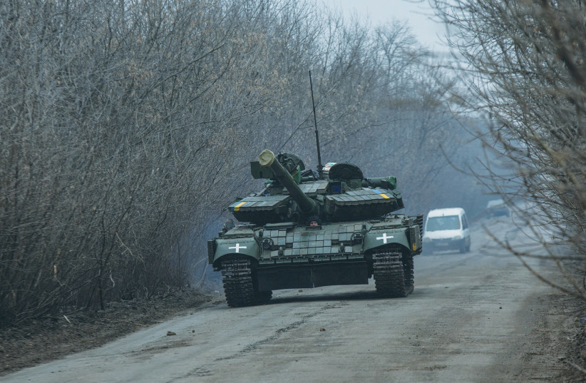  A UKRAINIAN ARMY tank travels on a road in Donetsk region, last week. (photo credit: Oleksandr Ratushniak/Reuters)