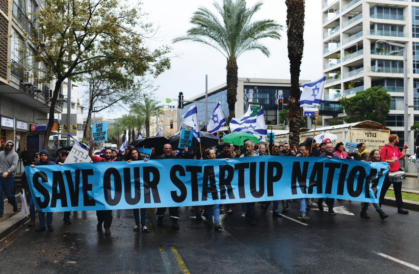  WORKERS FROM the hi-tech sector protest against the proposed changes to the legal system, in Tel Aviv, on Tuesday. (credit: TOMER NEUBERG/FLASH90)
