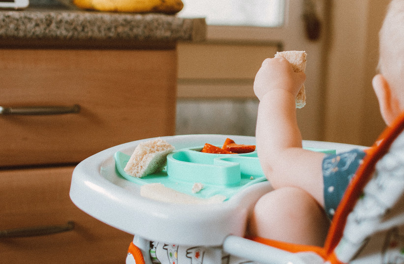  Infant eating food (illustrative) (photo credit: PEXELS)