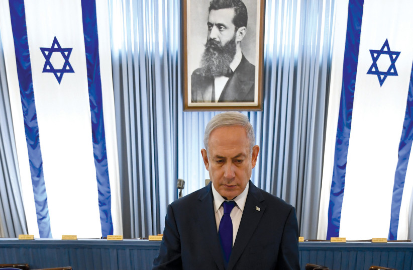  Prime Minister Benjamin Netanyahu looks at the Declaration of Independence on Israel’s 70th anniversary at Independence House in Tel Aviv.  (photo credit: HAIM ZACH/GPO)