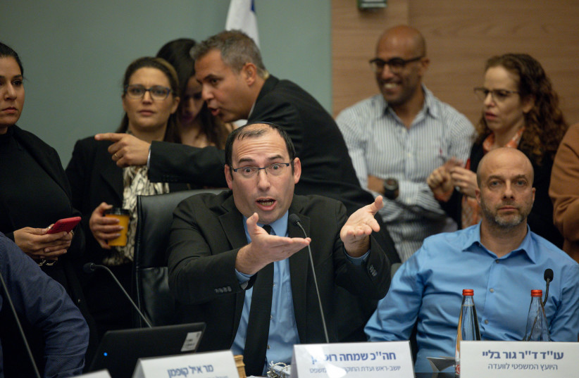  MK Simcha Rothman is seen gesturing amid a chaotic session of the Knesset Law and Constitution Committee in Jerusalem during a debate on judicial reform, on February 13, 2023. (photo credit: YONATAN SINDEL/FLASH90)