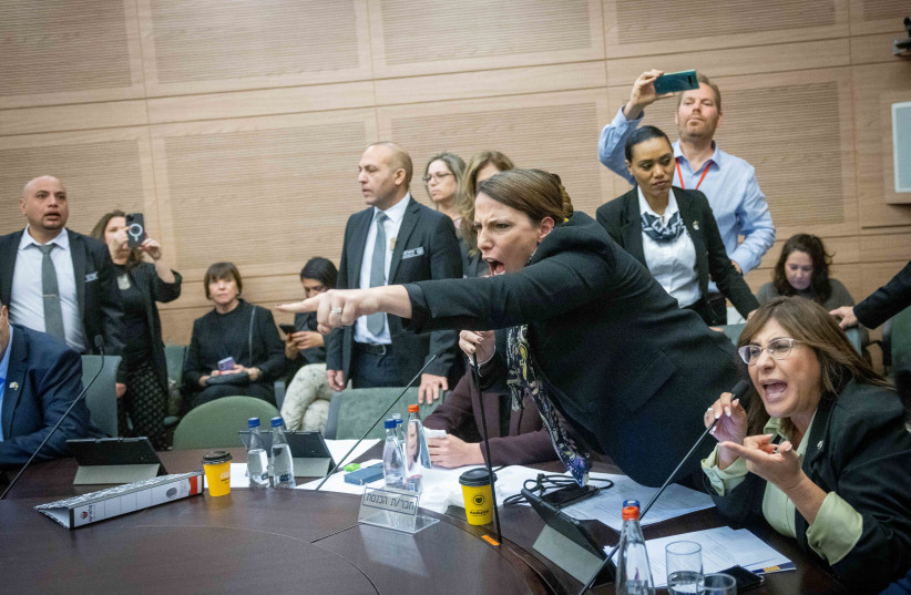  Israeli lawmakers gesture amid a chaotic session of the Knesset Law and Constitution Committee in Jerusalem during a debate on judicial reform, on February 13, 2023. (credit: YONATAN SINDEL/FLASH90)