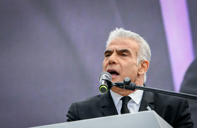  MK Yair Lapid seen at a protest against the judicial overhaul, outside the Israeli parliament in Jerusalem. February 13, 2023.  (photo credit: ARIE LEIB ABRAMS/FLASH 90)