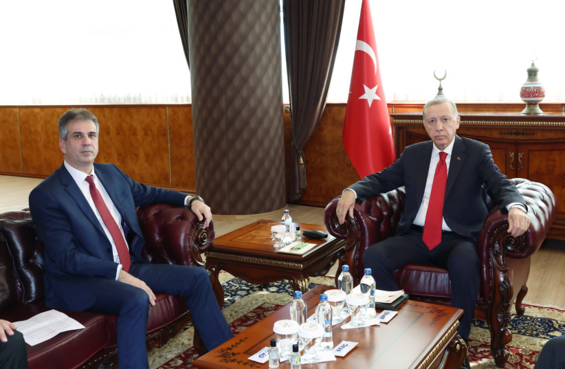  Israeli Foreign Minister Eli Cohen is seen sitting next to Turkey's President Recep Tayyip Erdogan in Turkey, on February 14, 2023. (credit: Turkish President's Office)