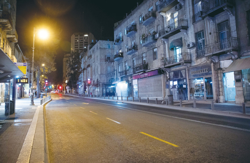  A JERUSALEM street is almost empty, January 2021, during a nationwide lockdown. COVID taught us a lesson as to the extent to which the government depends on voluntary public cooperation, says the writer. (credit: YONATAN SINDEL/FLASH90)