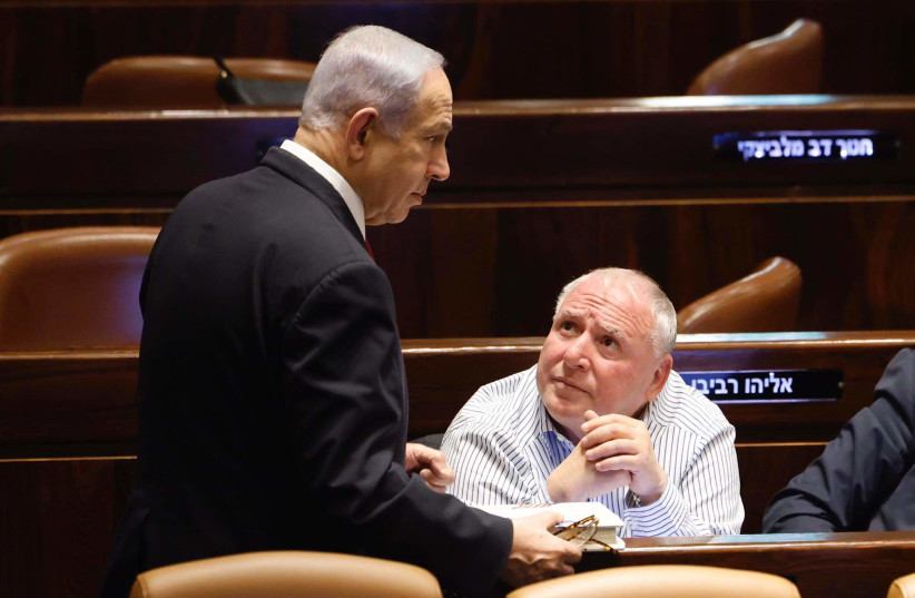  Israeli Prime Minister Benjamin Netanyahu (L) is seen next to Likud MK David Amsalem in the Knesset plenum in Jerusalem, on February 20, 2023. (credit: MARC ISRAEL SELLEM/THE JERUSALEM POST)
