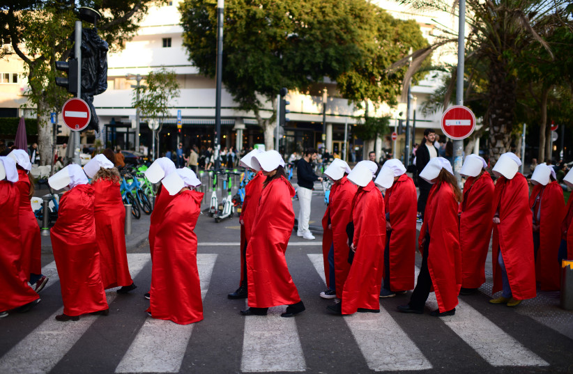  Israelis dressed as characters from The Handmaid's Tale television show protest the Israeli government's planned judicial overhaul, in Tel Aviv, February 25, 2023.  (photo credit: TOMER NEUBERG/FLASH90)