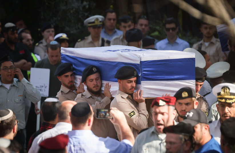  Friends and family attend the funeral of brothers Hallel, 21, and Yagel Yaniv, 19, at Mount Herzl military cemetery in Jerusalem. The two brothers were shot dead last night in a terror attack in the West Bank city of Huwara. February 27, 2023.  (credit: YONATAN SINDEL/FLASH90)