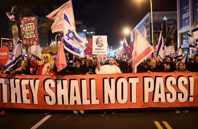  Israelis march in Tel Aviv during a protest against the Israeli government's planned judicial overhaul, February 25, 2023. (photo credit: TOMER NEUBERG/FLASH90)