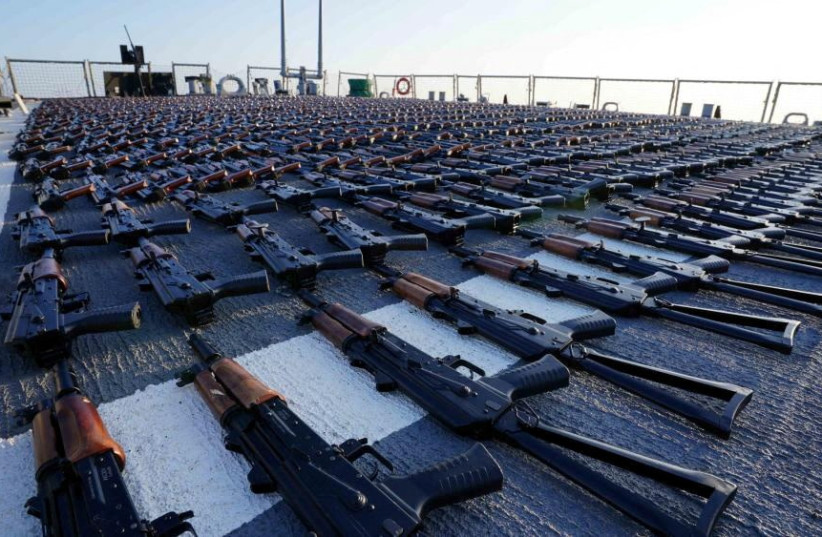  Thousands of AK-47 assault rifles, seized from a fishing vessel transiting along a maritime route from Iran to Yemen, sit on the flight deck of guided-missile destroyer USS The Sullivans (DDG 68) during an inventory process, in the Gulf of Oman in Arabian Sea, in this photo taken January 7, 2023. (photo credit: US NAVY/HANDOUT VIA REUTERS)