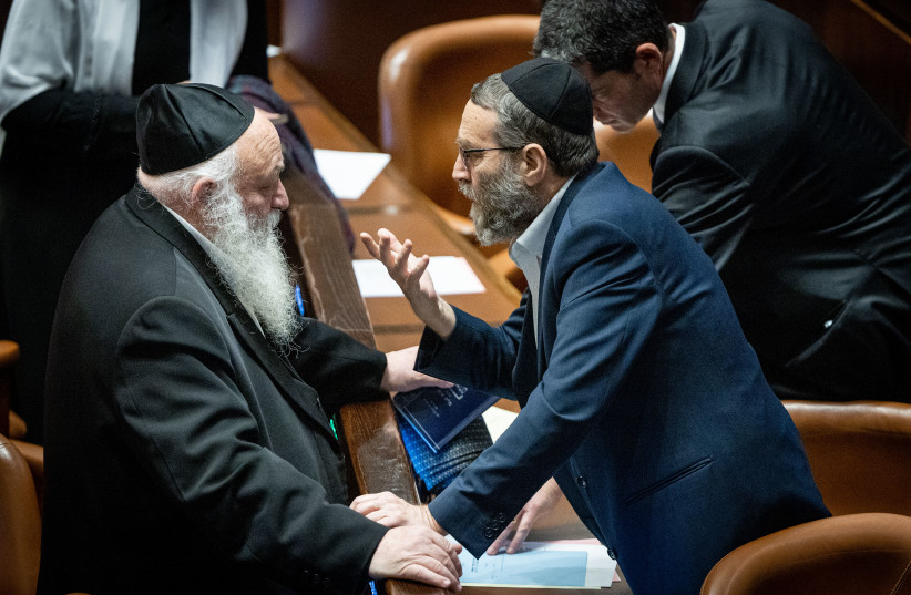  United Torah Judaism MKs Yitzchak Goldknopf and Moshe Gafni at a vote in the plenum session at the assembly hall of the Knesset, the Israeli parliament in Jerusalem, on December 20, 2022.  (credit: YONATAN SINDEL/FLASH90)