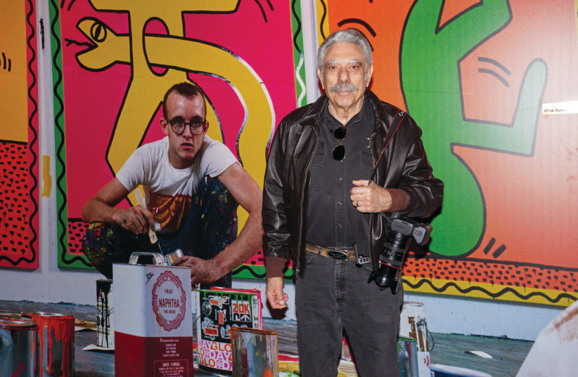  AMERICAN PHOTOGRAPHER Allan Tannenbaum with an image of Keith Haring at the exhibit opening on Wednesday. (photo credit: SHOOKA COHEN)