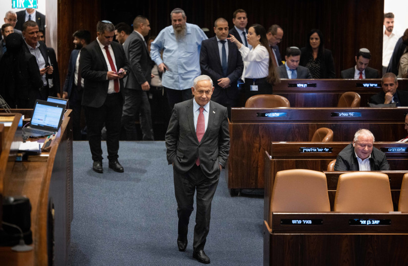  Prime Minister Benjamin Netanyahu is seen in the assembly hall of the Knesset, the Israeli parliament in Jerusalem, on March 13, 2023 (photo credit: YONATAN SINDEL/FLASH90)
