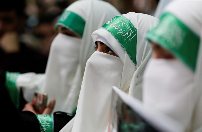  Palestinian students supporting Hamas take part in an election campaign for students' council at Palestine Polytechnic University in Hebron, in the Israeli-occupied West Bank March 13, 2023.  (photo credit: REUTERS/MUSSA QAWASMA)