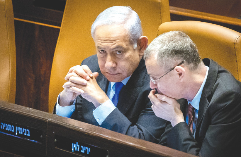  PRIME MINISTER Benjamin Netanyahu is believed to be aware that should he decide to put the brakes on the process, and Justice Minister Yariv Levin might well decide to resign. (photo credit: YONATAN SINDEL/FLASH90)